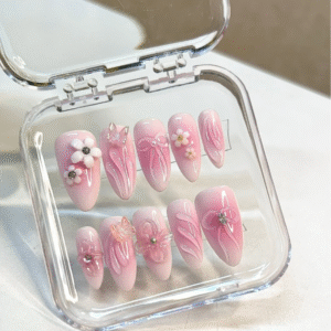 Pink press-on nails with black and white swirl nail art, almond shape – set of 10 in transparent case