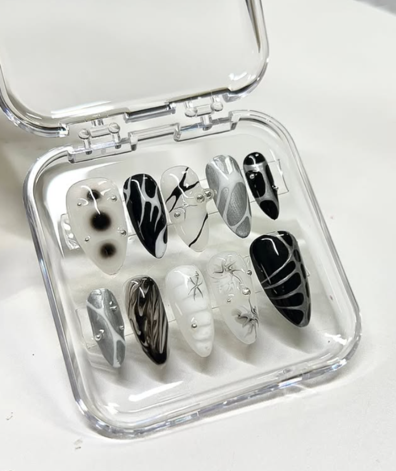 Black and white abstract press-on nails with leaf design, almond shape – set of 10 in transparent case